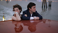 image of woman and man travelling on boat in venice